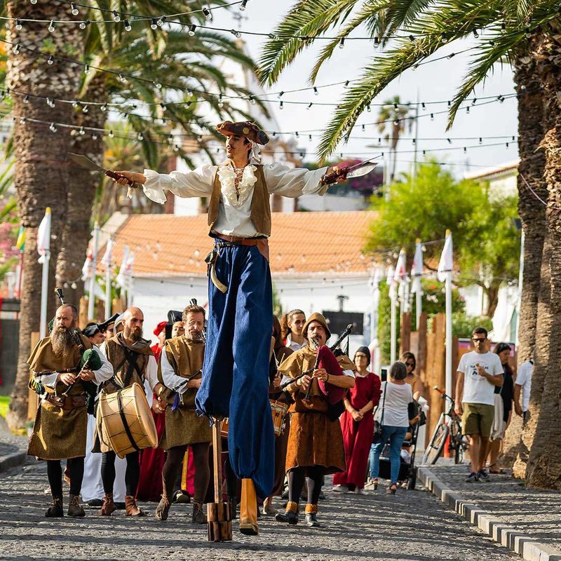 Columbus Festival Porto Santo medieval stilt walker palm trees