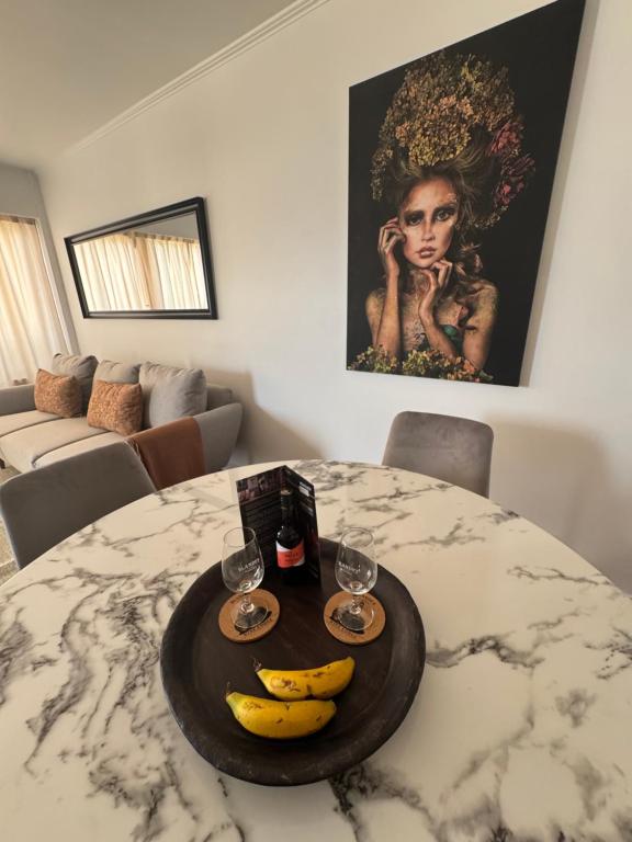 Infante Home — elegant living and dining area with marble table