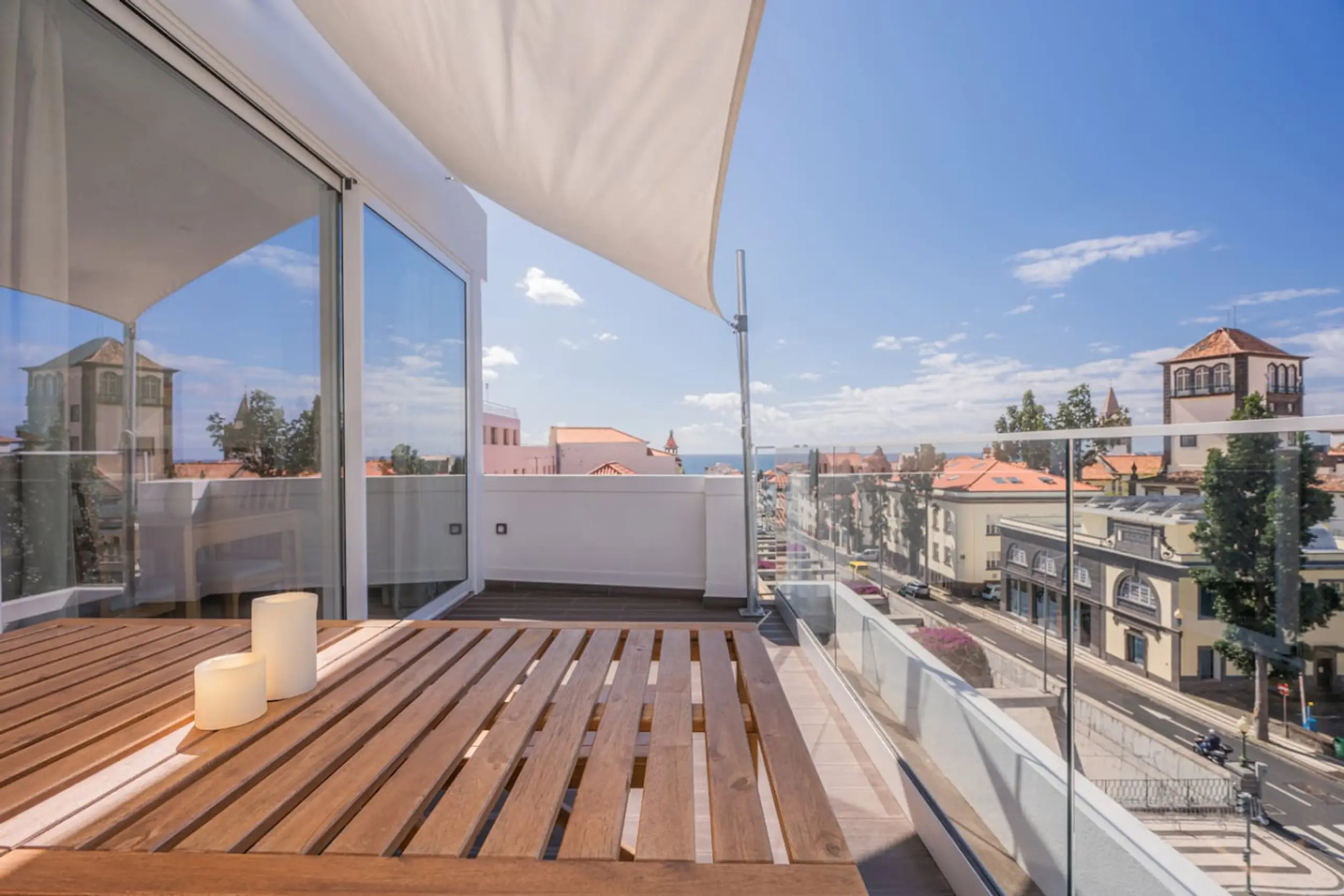 Bright studio interior with ocean view balcony in Funchal centre